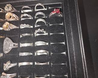 Bohemian tray: Vintage unworn silver tone fashion rings featuring crown, tiara, lotus, floral, feather, and celestial designs with colorful accent stones. CZ and colored stone tray: Vintage unworn silver tone fashion rings featuring halo, teardrop, and solitaire inspired designs with colorful accent stones in various cuts and settings.
