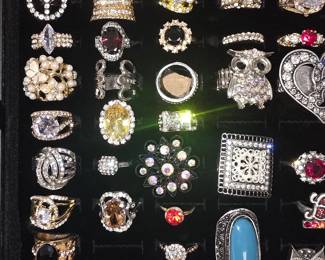 Vintage and fashion jewelry collection featuring rings, earrings, bracelets, necklaces, and accessories in gold and silver tone finishes