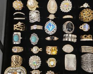 Vintage and fashion jewelry collection featuring rings, earrings, bracelets, necklaces, and accessories in gold and silver tone finishes