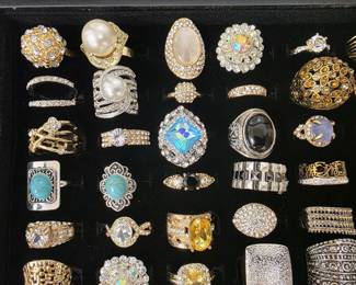 Vintage and fashion jewelry collection featuring rings, earrings, bracelets, necklaces, and accessories in gold and silver tone finishes