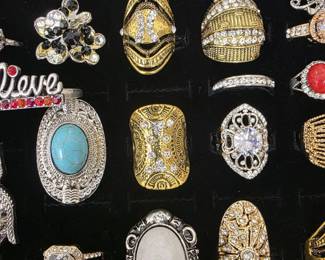 Vintage and fashion jewelry collection featuring rings, earrings, bracelets, necklaces, and accessories in gold and silver tone finishes