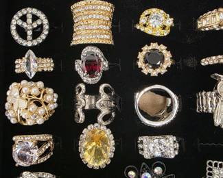 Vintage and fashion jewelry collection featuring rings, earrings, bracelets, necklaces, and accessories in gold and silver tone finishes