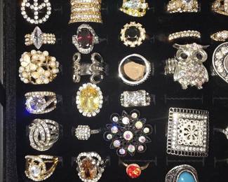 Vintage and fashion jewelry collection featuring rings, earrings, bracelets, necklaces, and accessories in gold and silver tone finishes