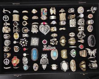 Vintage and fashion jewelry collection featuring rings, earrings, bracelets, necklaces, and accessories in gold and silver tone finishes