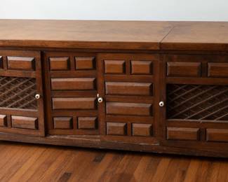 Vintage Spanish Brutalist-style wood media console/cabinet with geometric paneled doors and grille-front side cabinets. Turntable/components not included. Great for repurposing.