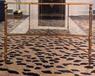 Uttermost Henzier Gilded Metal Coffee Table with Mirrored Top and Glass Shelf. Measures 38" L x 28" W x 19 1/2 " H. Photo 2 of 4.