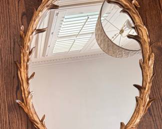 Hollywood Regency Ornate Gold Mirror with Carved Laurel Leaf Frame. Some Damage. Measures 21" W x 30" H. Photo 1 of 4.