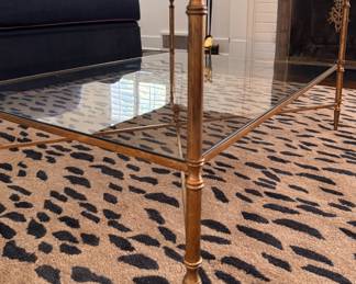 Uttermost Henzier Gilded Metal Coffee Table with Mirrored Top and Glass Shelf. Measures 38" L x 28" W x 19 1/2 " H. Photo 3 of 4.