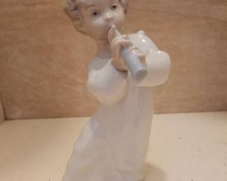 Lladró (Hand-crafted in Valencia, Spain).Model: "Angel with Flute" $40