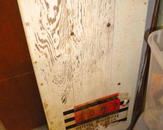 Old wooden ironing board with paper logo 