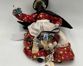 handmade folk art peddler doll with an apple head, fashioned by an artist named A. Clark