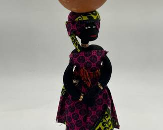 Senegalese cloth doll featuring a woman with a bowl on her head.