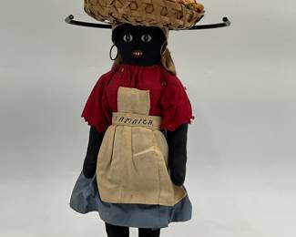 vintage Jamaican rag doll features a handmade straw basket hat on her head