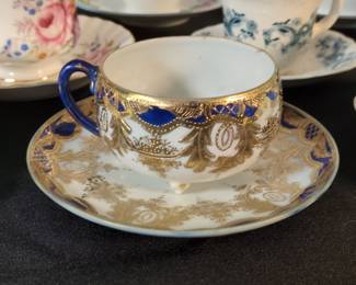 Hand Painted Gilt Porcelain Teacup and Saucer