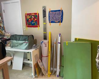 Sewing room full of goodies! Material, sewing, cross stitch and quilting patterns, batting, and many sewing notions.