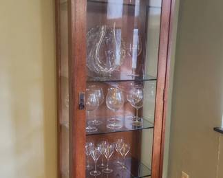 stickley display cabinet with riedel wine glasses and decanter