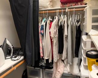 Assorted Clothing and Household Items in a Closet