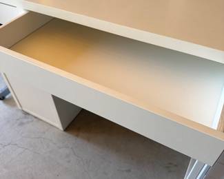 IKEA bookshelves, and desks