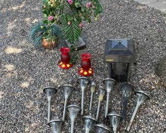 A Few Solar Lights, Humming Bird Feeders, Bug Zapper And Two Faux Plants