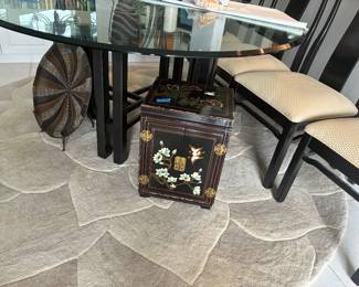 Thick luxurious glass on elegant black base. Rug and items underneath also for sale