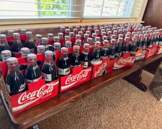 Collection of Coca-Cola Classic glass bottles