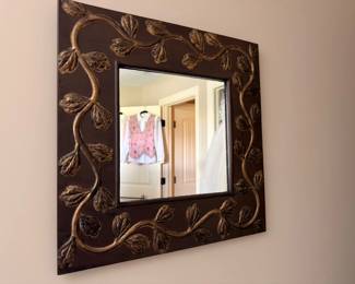 Ornate carved wood framed wall mirror