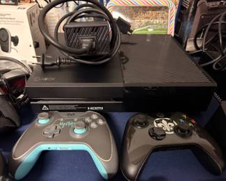 Xbox One console with two controllers