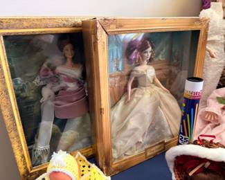 Collector Barbie dolls in display cases