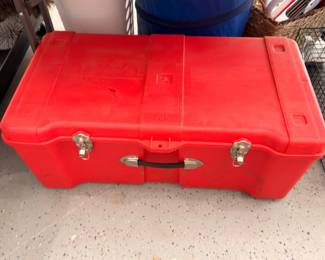 Red hard-sided storage trunk