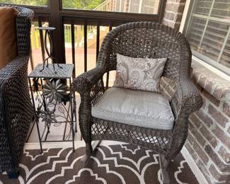 Wicker patio chair and metal plant stand