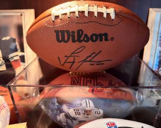 Autographed Wilson NFL football in display case