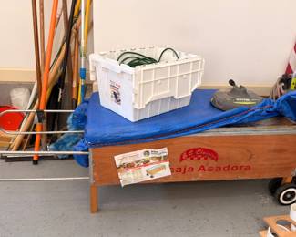 Yard tools, storage tote and Baja Asadora grill