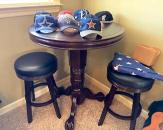 Pub bistro table with two swivel bar stools
