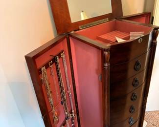 Standing jewelry armoire with mirror