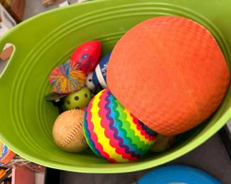 Bin of playground balls and outdoor toys