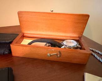 Wooden watch box with wristwatch