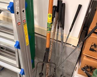 Ladder and long-handled garden tools