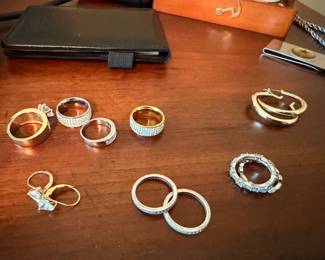 Assorted gold rings, bands and hoop earrings