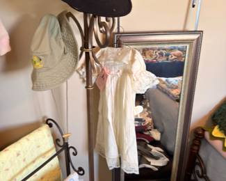 Hat rack, floor mirror and vintage clothing