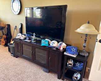 Flat-screen TV and wood media console cabinet
