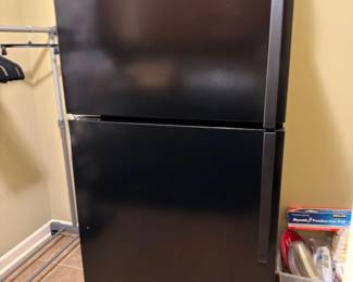 Black Whirlpool top-freezer refrigerator