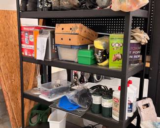 Garage storage shelf with tools and supplies