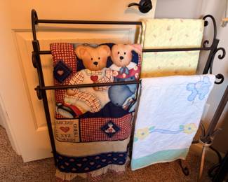 Iron quilt rack with baby quilts