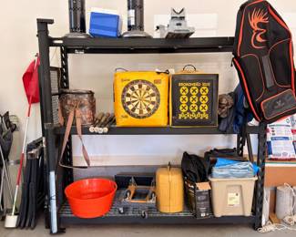 Garage shelf with dartboards and sporting goods