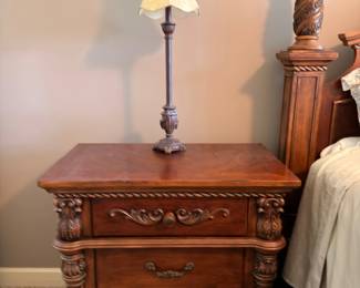 Carved wood nightstand with lamp