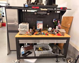 Workbench with tools and pegboard