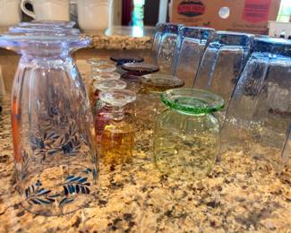 Assorted glassware — colored and patterned tumblers