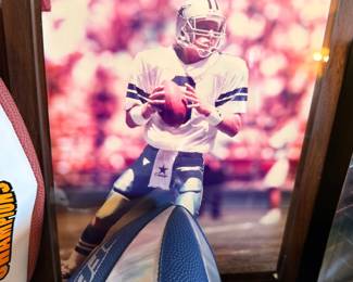 Framed Cowboys quarterback photo with footballs