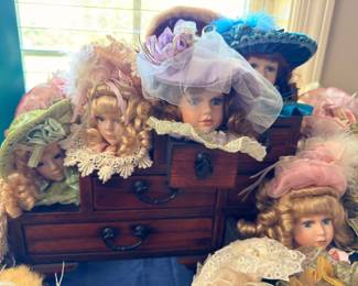 Wooden chest with porcelain dolls
