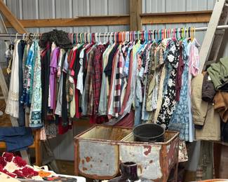 Various sizes of sundresses, pants coats. Some still have tags 